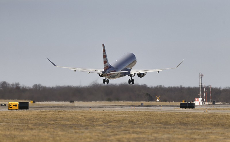 FILE -- A commercial plane departs, Friday, January 23, 2021 at the Northwest Arkansas National Airport in Bentonville.
(NWA Democrat-Gazette/Charlie Kaijo)