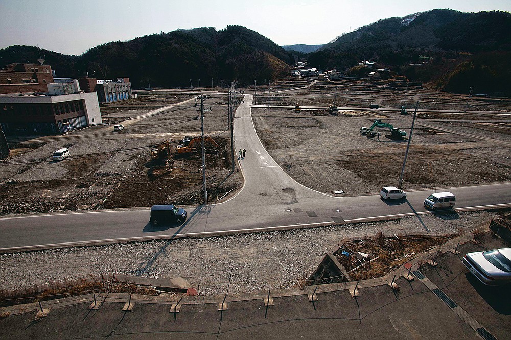 In this file photo dated February 22, 2012, two officers are walking down a street as the tsunami and earthquake devastated Onagawa City, Miyagi Prefecture, northern Japan.  (AP Photo / David Guttenfelder, file)