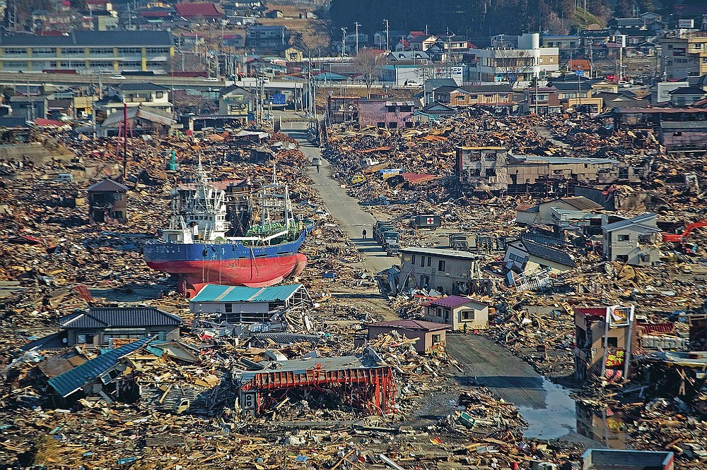 In this file photo dated March 28, 2011, a ship is in a destroyed residential area in Kesennuma, Miyagi Prefecture, northeastern Japan, after a strong tsunami hit the area on March 11th.  (AP Photo / David Guttenfelder, file)