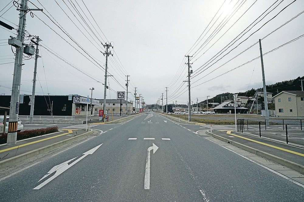 Almost 10 years after the 2011 tsunami disaster, recovered streets can be seen in Kesennuma, Miyagi Prefecture, northeast Japan, Friday March 5, 2021.  (AP Photo / Eugene Hoshiko)
