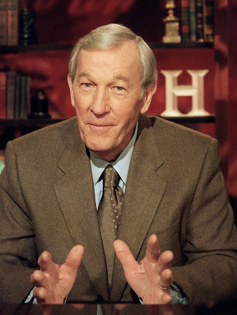 FILE - In this Aug. 6, 2001, file photo, veteran journalist Roger Mudd tapes a segment for the History Channel at CBS studios in New York. Mudd, the longtime political correspondent and anchor for NBC and CBS who once stumped Sen. Edward Kennedy by simply asking why he wanted to be president, died Tuesday, March 9, 2021. He was 93. (AP Photo/Marty Lederhandler, File)