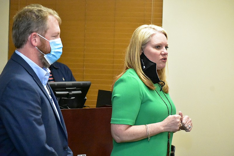 Tim Tyler, regional director of operations for SSC custodial services, and Tammy Reed, SSC regional sales director, speak to White Hall school board members on Tuesday. (Pine Bluff Commercial/I.C. Murrell)