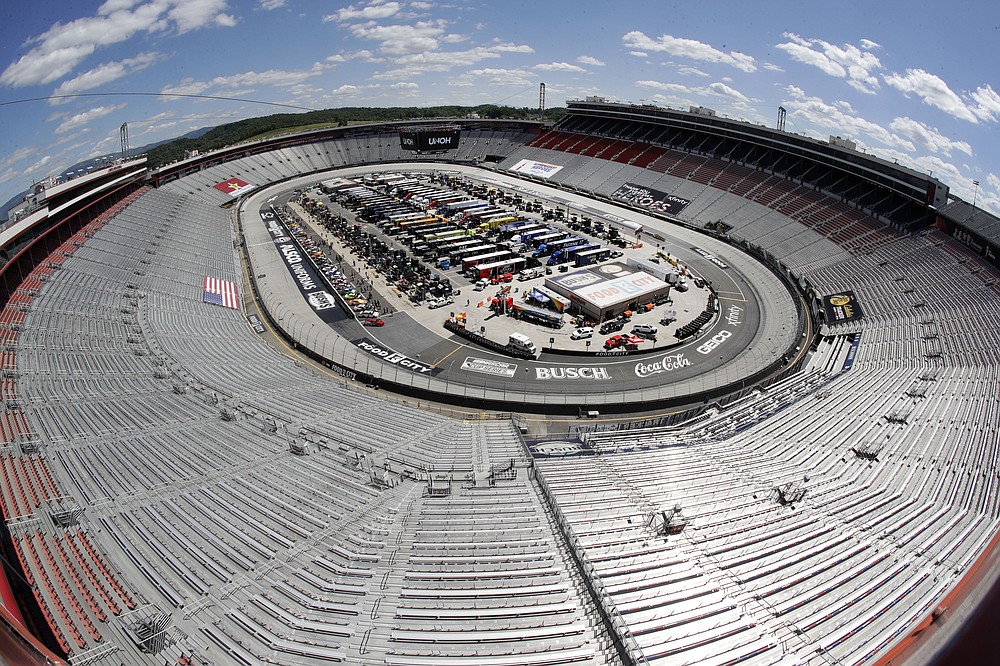 FILE - The stands sit empty as drivers prepare for the start of a NASCAR Cup Series auto race at Bristol Motor Speedway in Bristol, Tenn., in this May 31, 2020, file photo. Sports amid the pandemic became a whole different sort of spectacle, especially when it came to spectators — often with zero. (AP Photo/Mark Humphrey, File)