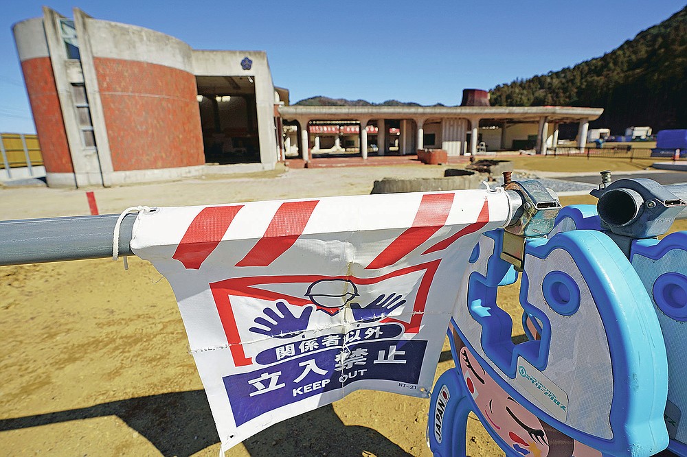 Former Okawa Elementary School where 74 children from the school lost their lives along with 10 teachers by a massive tsunami in 2011, is seen in Ishinomaki, Miyagi Prefecture, northern Japan Saturday, March 6, 2021. The elementary school was decided to preserve reminders of the March 11, 2011, disaster. (AP Photo/Eugene Hoshiko)