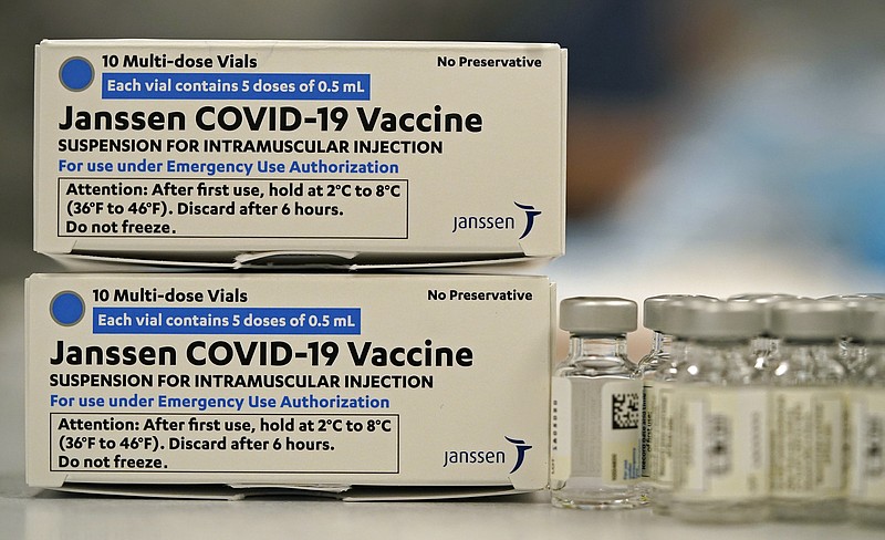 Boxes containing the Johnson & Johnson COVID-19 vaccine sit next to vials in the pharmacy of National Jewish Hospital for distribution early Saturday, March 6, in east Denver. - AP Photo/David Zalubowski