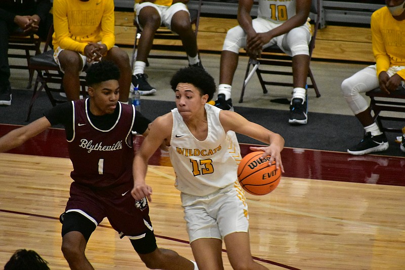 Christopher Fountain of Watson Chapel drives to the basket against Brian Jones of Blytheville in the second half Friday at Morrilton High School. (Pine Bluff Commercial/I.C. Murrell)