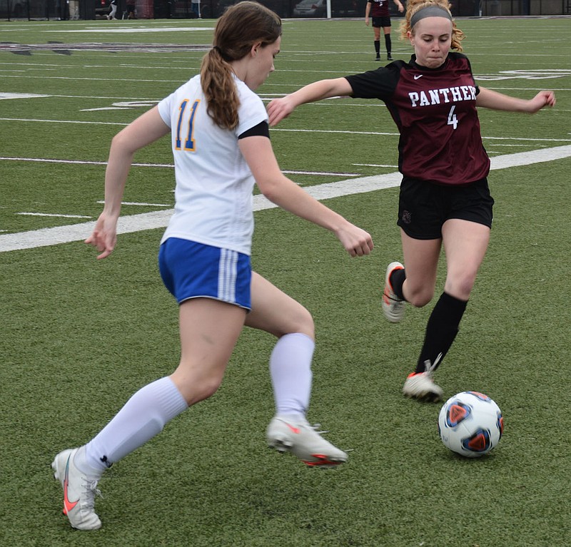 Graham Thomas/Siloam Sunday
Mountain Home's Zoe Croom, left, and Siloam Springs senior Macie Herrel go after a ball during Friday's 5A-West Conference game at Panther Stadium. The Lady Panthers defeated the Lady Bombers 3-1.