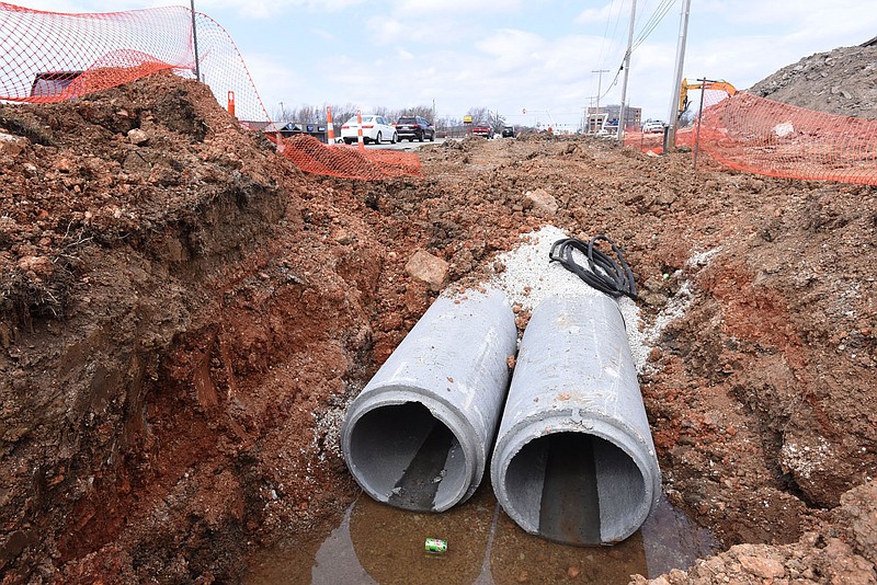 Drainage work is ongoing March 9 2021 along Walton Boulevard south of the Walmart Home Office. 
(NWA Democrat-Gazette/Flip Putthoff)