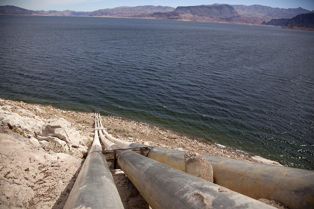 FILE - This March 23, 2012, file photo, shows pipes extending into Lake Mead well above the high water mark near Boulder City, Nev. A plan by Utah could open the door to the state pursuing an expensive pipeline that critics say could further deplete the lake, which is a key indicator of the Colorado River's health. (AP Photo/Julie Jacobson, File)