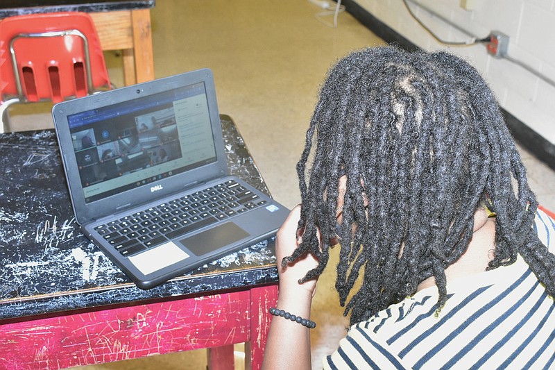 Carman Wilson, a physical science instructor at Pine Bluff High School, teaches students through virtual learning from her classroom Wednesday. (Pine Bluff Commercial/I.C. Murrell)