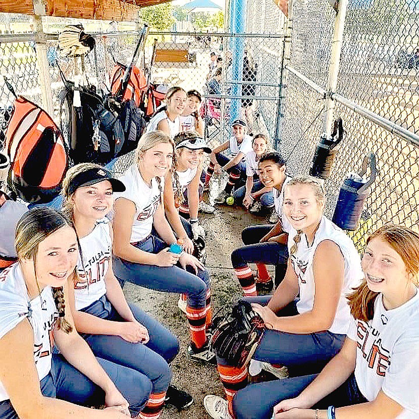 Submitted Photo/Lincoln rising ninth grader Brinkley Moreton (third from left) poses with her travel ball team, the Tulsa Elite NWA06 24-25, while preparing to compete at Broomfield, Colo. this summer. Brinkley rebounded after experiencing a blood clot in her right arm, weeks of being on blood thinners administered through shots in the belly, and predictions she wouldn't play this summer, and is miraculously back on the softball field.