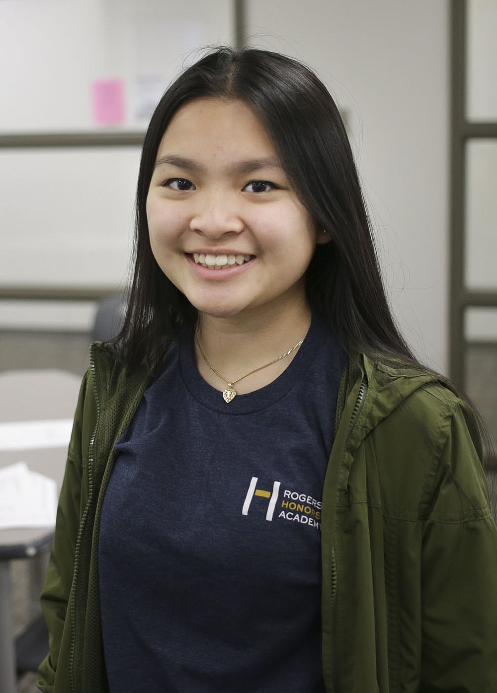 Erica Vu, wearing a Rogers Honors Academy shirt, poses for a portrait, Thursday, February 25, 2021 at Rogers New Tech High School in Rogers. Rogers Honors Academy students sat in on a college preparedness course. Check out nwaonline.com/210226Daily/ for today's photo gallery.
(NWA Democrat-Gazette/Charlie Kaijo)