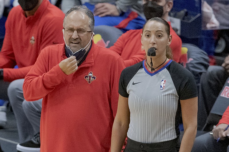 New Orleans Pelicans coach Stan Van Gundy watches the team during the first half of an NBA basketball game against the Cleveland Cavaliers in New Orleans, Friday, March 12, 2021. (AP Photo/Matthew Hinton)