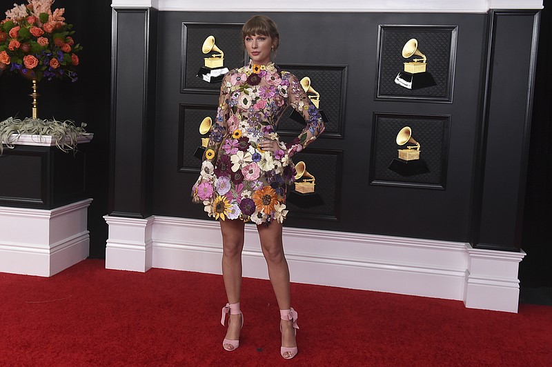 Taylor Swift poses in the press room at the 63rd annual Grammy Awards at the Los Angeles Convention Center on Sunday, March 14, 2021. (Photo by Jordan Strauss/Invision/AP)