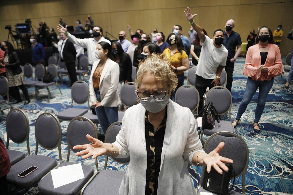 People attend a church service with the Rev. Gabriel Salguero at The Gathering Place in Orlando, March 7, 2021. ҉n getting yourself vaccinated, you are helping your neighbor,Ӡhe preached to about 300 masked and socially distanced worshipers. ҇od wants you to be whole so you can care for your community. So think of vaccines as part of Godճ plan.Ӡ(Octavio Jones/The New York Times)