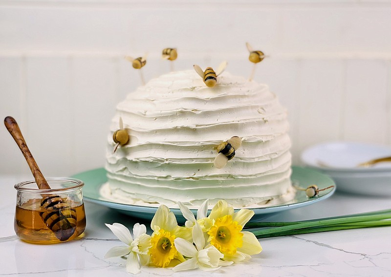 Beehive Cake is frosted in a honey buttercream and decorated with marzipan bees. (Arkansas Democrat-Gazette/Kelly Brant)