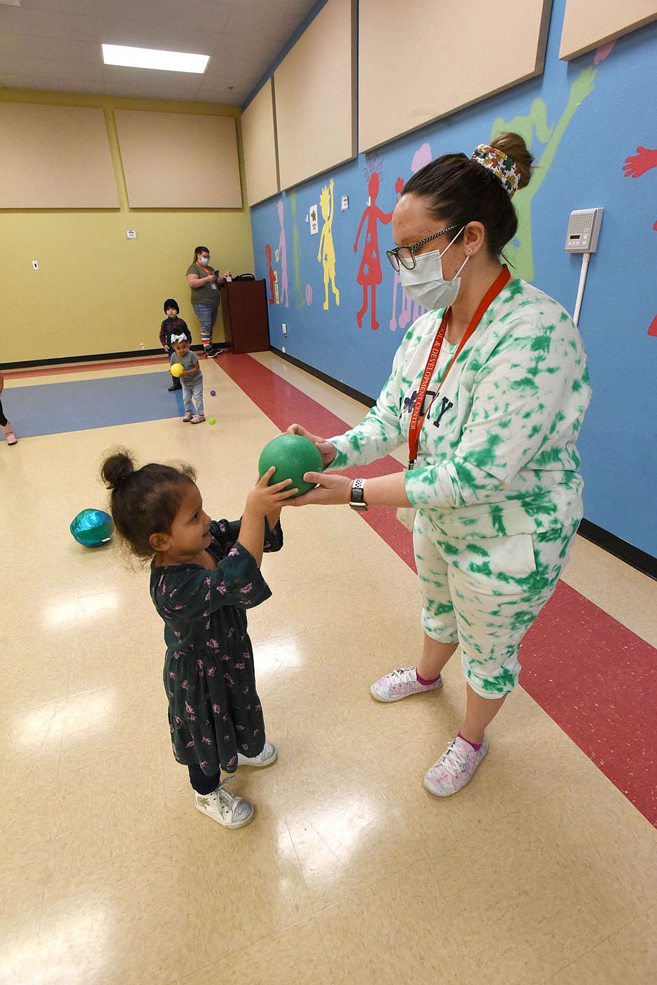 Teacher Katie Jennings plays with children on Wednesday March 17 2021 at the Benton County Sunshine School and Development Center.
(NWA Demorcrat-Gazette/Flip Putthoff)