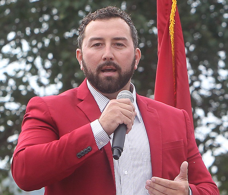 Morfe Manufacturing co-owner and CEO Morgan Wiles speaks to a crowd in Mountain Pine on Sept. 27, 2017. - File photo by The Sentinel-Record