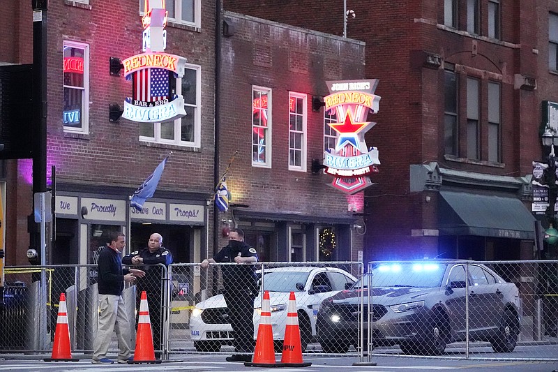 FILE - In this Dec. 28, 2020 file photo, police block off a part of the Broadway tourist district as a result of a bombing that took place on Christmas Day in Nashville, Tenn. (AP Photo/Mark Humphrey)