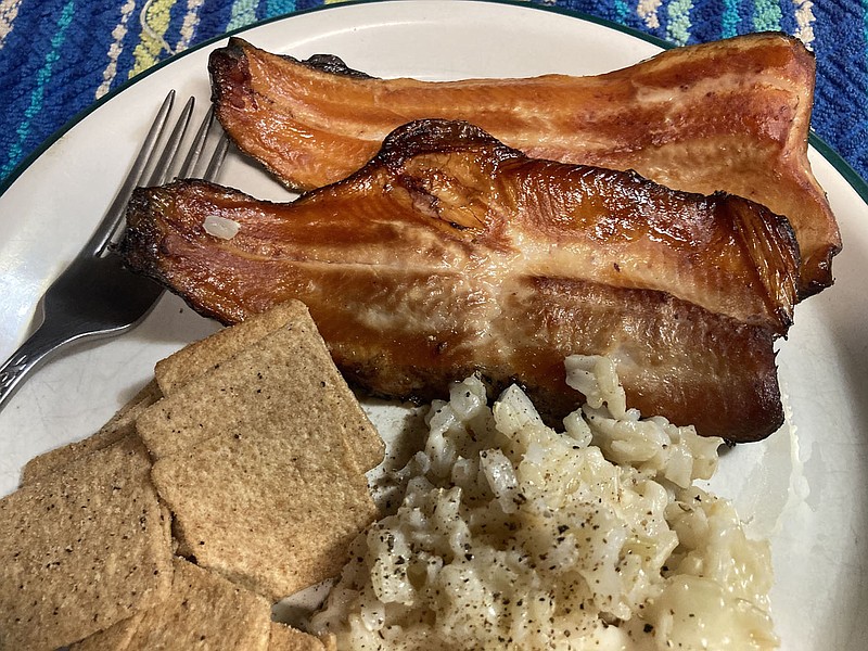 A smoked trout dinner    Feb. 23 2021     is a tasty finale after a day of trout fishing. The main ingredient for this smoked trout feast was caught from the White River below Beaver Dam just hours before smoking.
(NWA Democrat-Gazette/Flip Putthoff)