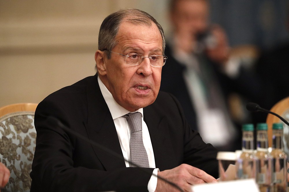 Russian Foreign Minister Sergey Lavrov speaks during an international peace conference in Moscow, Russia, Thursday, March 18, 2021. Russia is hosting a peace conference for Afghanistan, bringing together government representatives and their Taliban adversaries along with regional observers in a bid to help jump-start the country's stalled peace process. The one-day gathering Thursday is the first of three planned international conferences ahead of a May 1 deadline for the final withdrawal of U.S. and NATO troops from the country, a date fixed under a year-old agreement between the Trump administration and the Taliban. (AP Photo/Alexander Zemlianichenko, Pool)