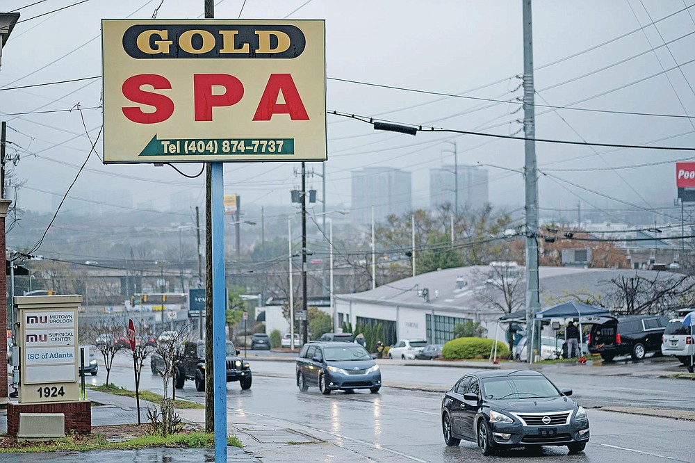 FILE - This Wednesday, March 17, 2021 file photo shows a sign for the Gold Spa massage business in Atlanta, the day after multiple people were killed at three massage spas in the Atlanta area. On Friday, March 19, 2021, The Associated Press reported on stories circulating online incorrectly asserting that on Tuesday, March 16, hours before police say Robert Aaron Long, 21, killed eight people at three Atlanta-area massage businesses, he posted on his Facebook that China was engaged in a “COVID coverup” and “AMERICANS NEED TO FIGHT BACK AGAINST CHINA, NOW.” But the post is not authentic. The fictitious image began circulating Tuesday night after Long, was identified as a suspect in the mass shootings that took place at the Atlanta-area massage businesses. (AP Photo/Ben Gray)