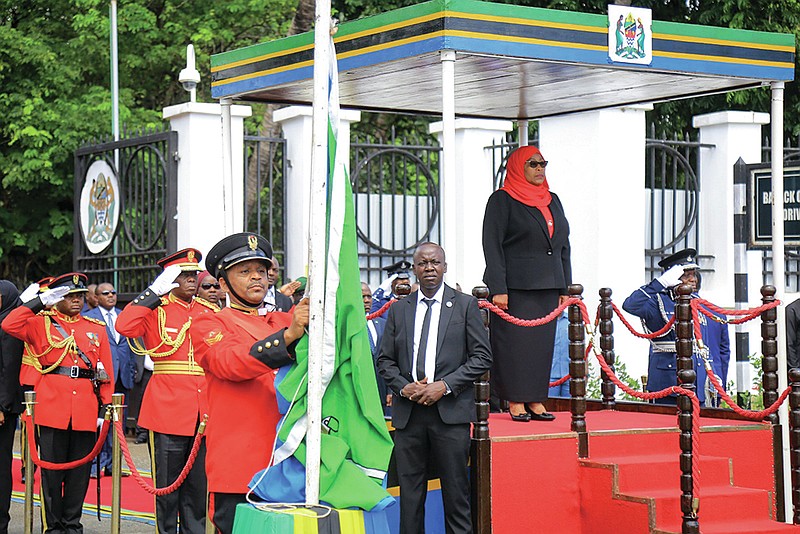 Tanzania’s new president, Samia Suluhu Hassan, is sworn in Friday at a ceremony at State House in Dar es Salaam. More photos at arkansasonline.com/320tanzania/.
(AP)