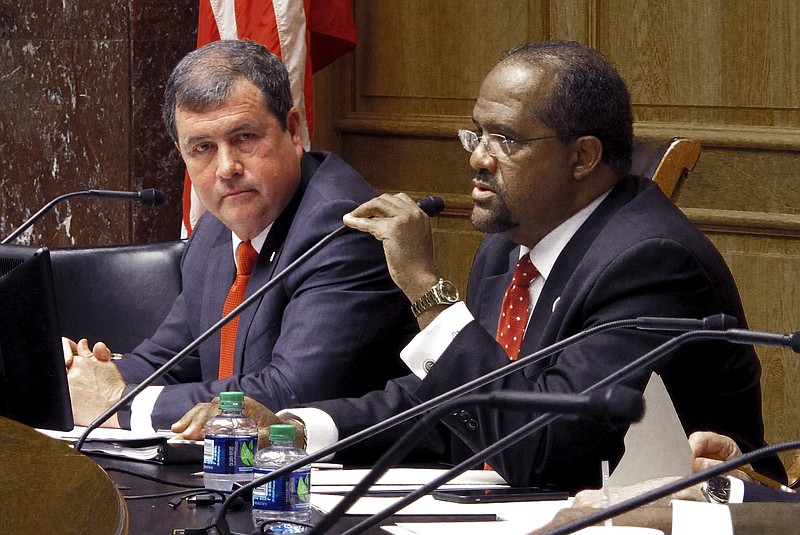 FILE - In this March 31, 2016, file photo, Sen. Troy Carter, right, D-New Orleans, second from left, speaks in favor of an equal pay bill in Baton Rouge, La. Carter is among several high-profile candidates who are seeking the Louisiana's 2nd District seat in a majority minority district that extends along the Mississippi River into Baton Rouge. (AP Photo/Melinda Deslatte, File)