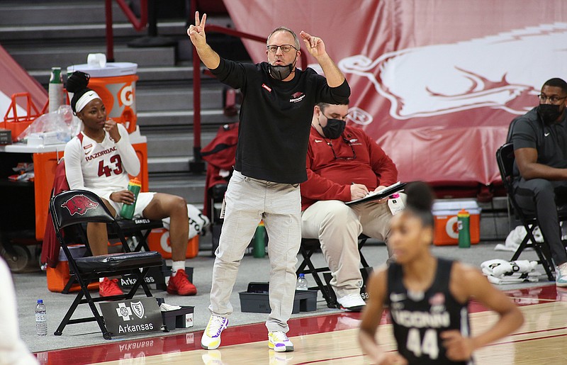 Arkansas women's head basketball coach Mike Neighbors gestures at his team during a Jan. 28 game against the Connecticut Huskies at Bud Walton Arena. The team faces off against Wright State today at 1 p.m. in the NCAA Division I Women's Basketball Tournament in Austin, Texas. - Photo by David Gottschalk of NWA Democrat-Gazette

nwasptboyduawomen20210129