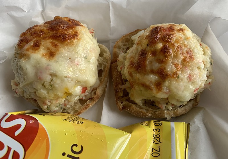 The crab salad from Delicious Temptations has quasi-crab surimi instead of actual crab meat, mounded on two halves of an English muffin and topped with melted provolone. (Arkansas Democrat-Gazette/Eric E. Harrison)