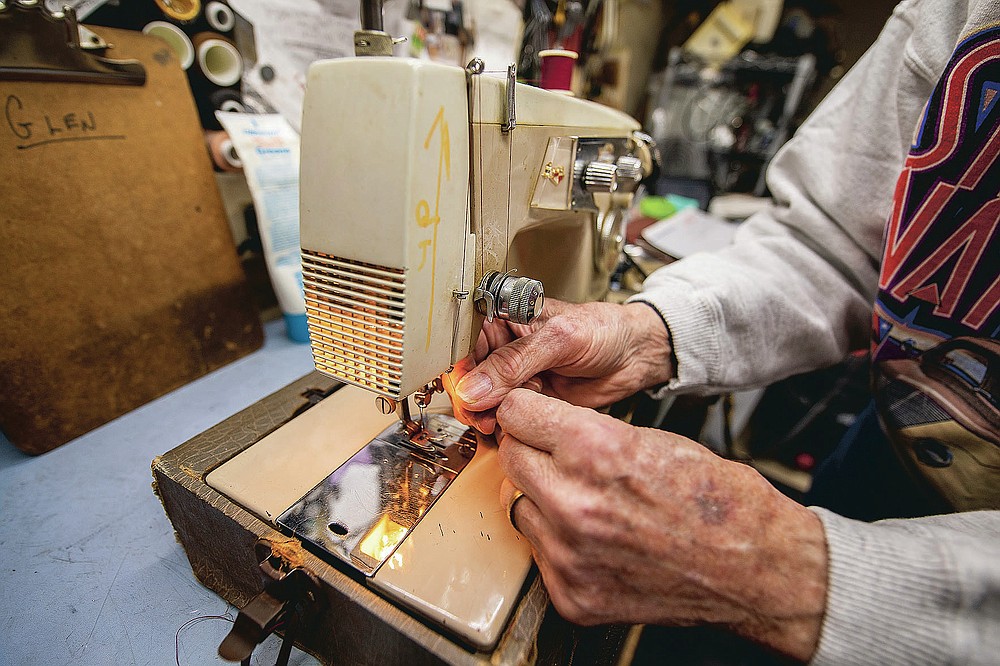 Glen Hilderbrand does an operation check, his first step on a machine, on a newly dropped off sewing machine at Klaiber's Sewing Center on March 3, 2021 in Bloomington, Ind. (Rich Janzaruk/The Herald-Times via AP)