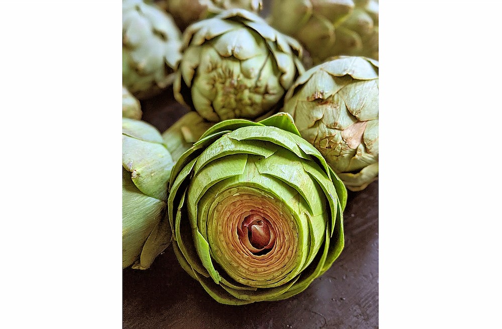 Artichokes look intimidating but they're actually very easy to cook and have tender, flavorful leaves. The peak season is March through May. (TNS/Post-Gazette/Gretchen McKay)