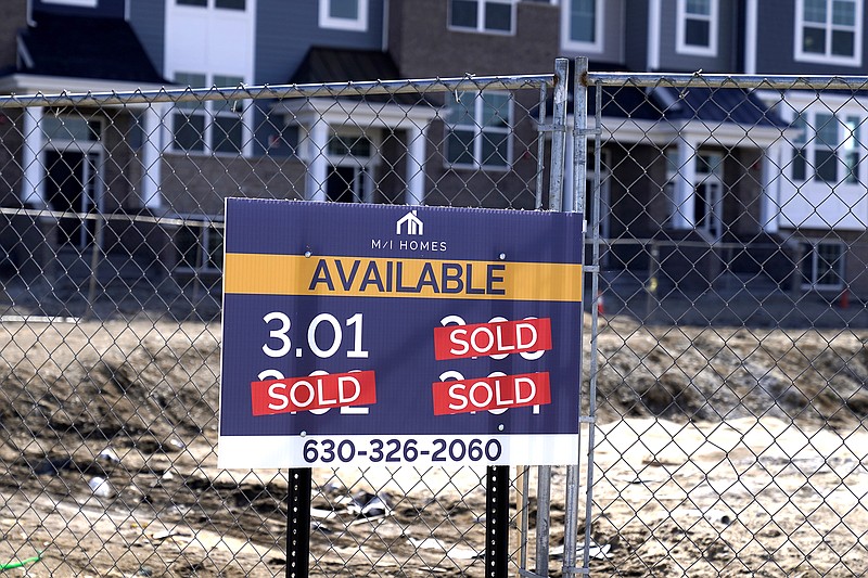 A* "sold" signs sit on a lot as new home construction continue in a new neighborhood in Northbrook, Ill., Sunday, March 21, 2021. U.S. long-term mortgage rates continued to edge higher this week as the benchmark 30-year loan stayed above the 3% mark. Rates remain near historic lows, however. (AP Photo/Nam Y. Huh)