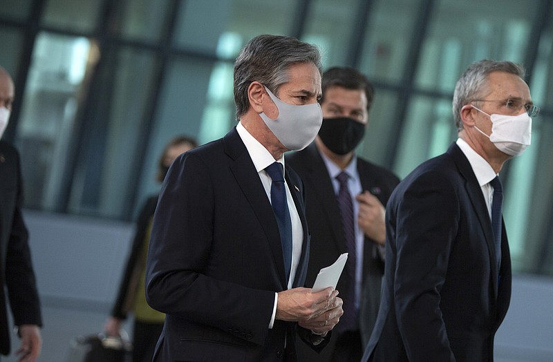 U.S. Secretary of State Antony Blinken, left, walks with NATO Secretary General Jens Stoltenberg, right, after addressing a media conference prior to a meeting of NATO foreign ministers at NATO headquarters in Brussels on Tuesday, March 23, 2021. (AP Photo/Virginia Mayo, Pool)
