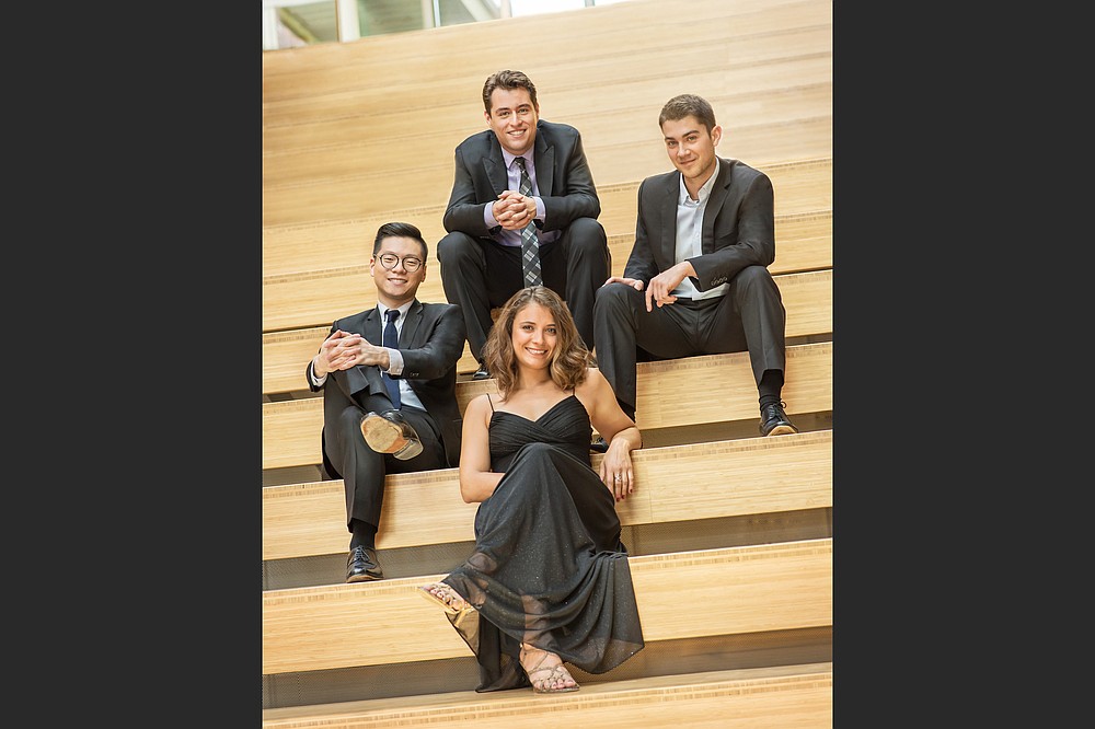 The Dover Quartet — (clockwise from left), Bryan Lee and Joel Link, violin; and Camden Shaw, cello; and Milena Pajaro-van de Stadt, viola — return to Fayetteville's Walton Arts Center for an Artosphere performance in May. (Special to the Democrat-Gazette/Carlin Ma)