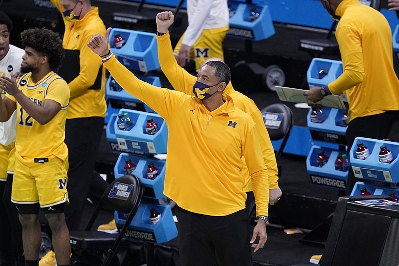 Michigan head coach Juwan Howard celebrates at the end of a second-round game against LSU in the NCAA men's college basketball tournament at Lucas Oil Stadium Monday, March 22, 2021, in Indianapolis. Michigan won 86-78. (AP Photo/Darron Cummings)