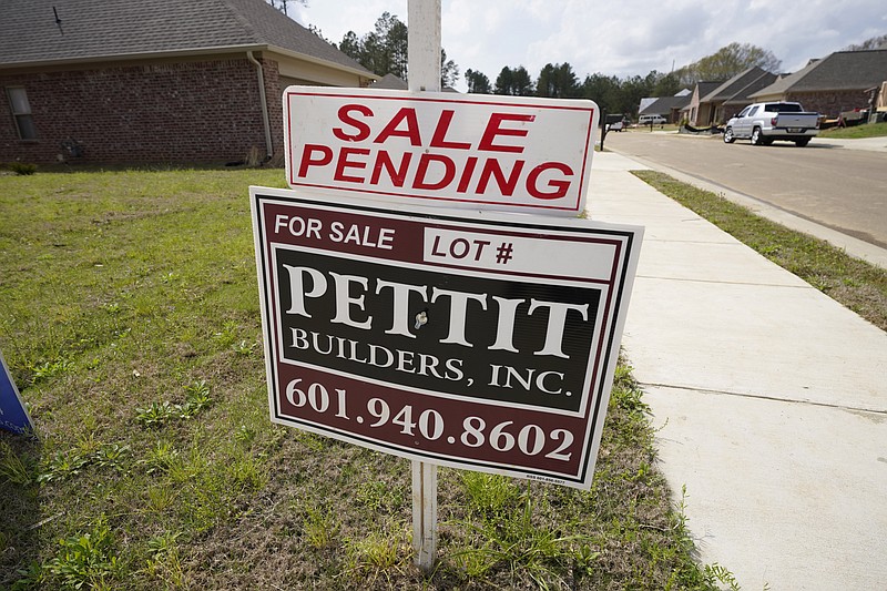 A "sale pending" sign stands along side a housing lot in Madison County, Miss., Tuesday, March 16, 2021. U.S. long-term mortgage rates continued to edge higher this week as the benchmark 30-year loan stayed above the 3% mark. Rates remain near historic lows, however.  (AP Photo/Rogelio V. Solis)