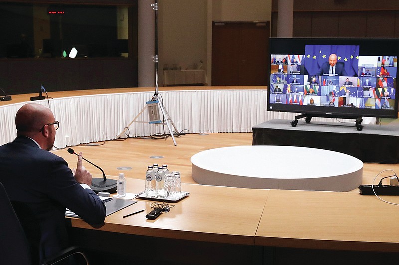 European Council President Charles Michel speaks with EU leaders, via videoconference link, during a EU summit at the European Council building in Brussels, Thursday, March 25, 2021. (Yves Herman, Pool via AP)