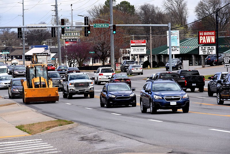 FILE — Traffic rolls Tuesday March 23 2021 through the intersection of Walton Boulevard and Central Avenue in Bentonville.
(NWA Democrat-Gazette/Flip Putthoff)