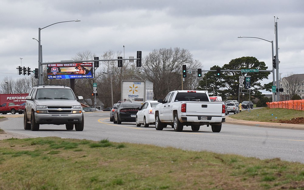 Traffic moves Tuesday March 23 2021 along Rainbow Curve in Bentonville.
(NWA Democrat-Gazette/Flip Putthoff)