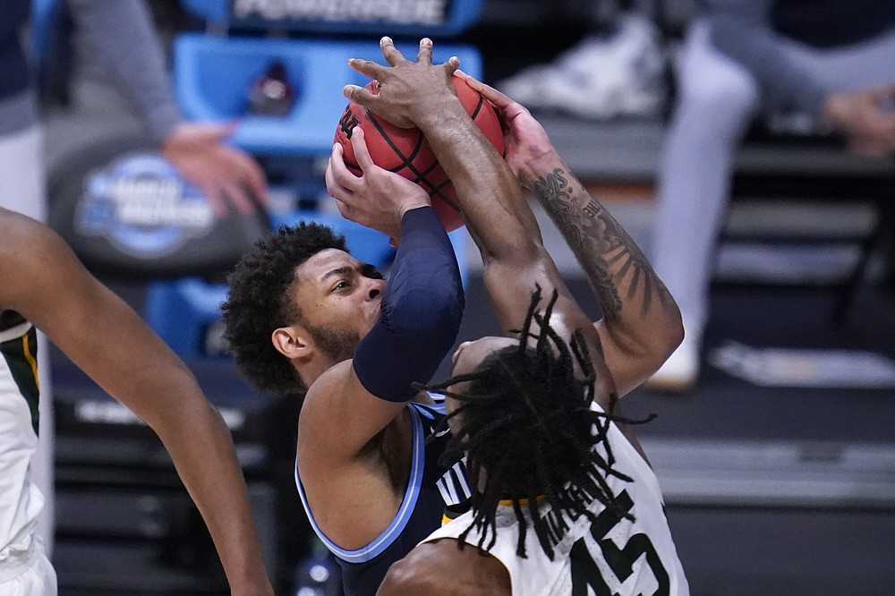 Baylor guard Davion Mitchell (45) blocks a Villanova guard Justin Moore (5)  shot in the second half of a Sweet 16 game in the NCAA men's college  basketball tournament at Hinkle Fieldhouse