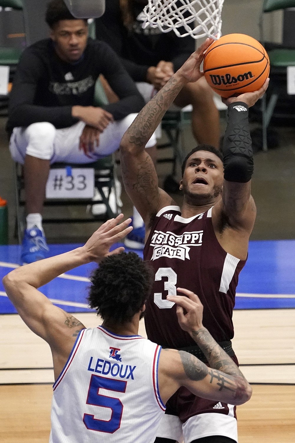 Louisiana Tech forward Kenneth Lofton Jr. advances the ball