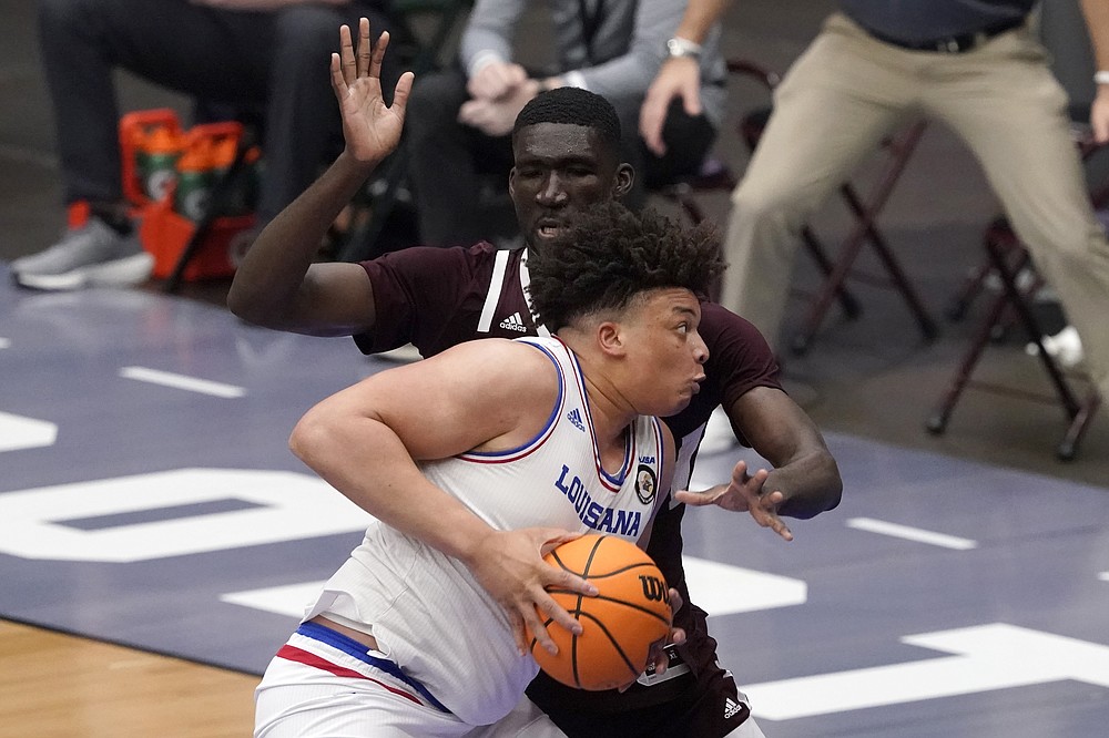 Louisiana Tech forward Kenneth Lofton Jr. advances the ball