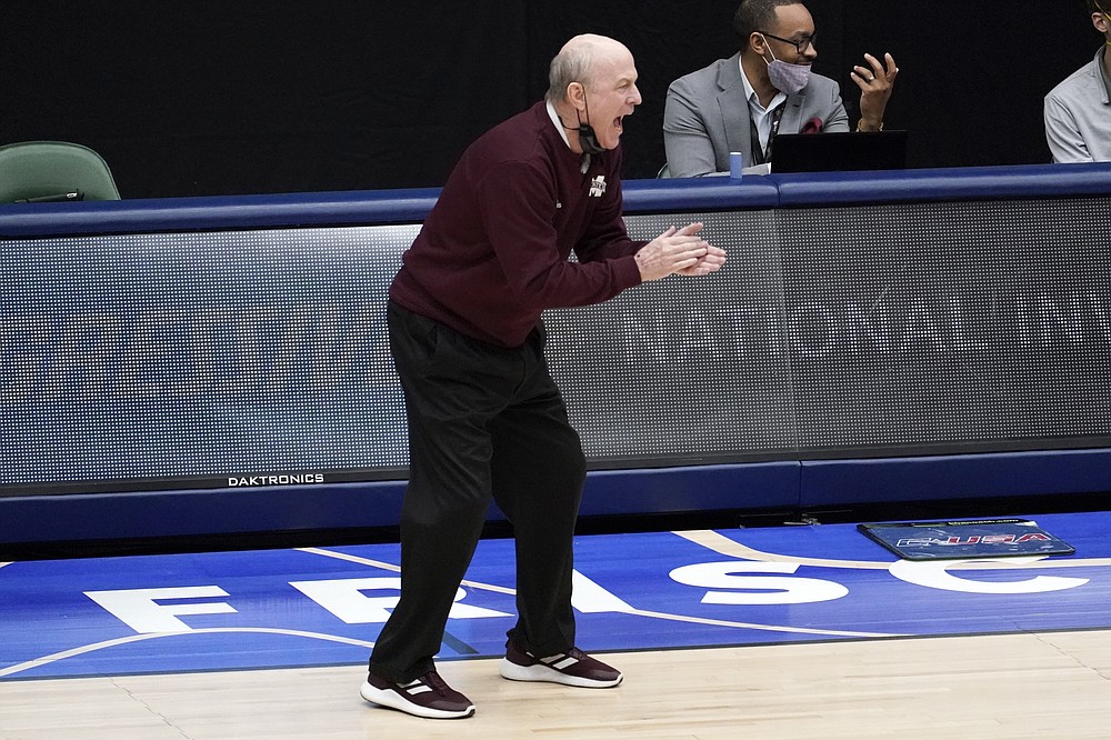 Mississippi State head coach Ben Howland applauds his team in the first half of an NCAA college basketball championship game against Memphis in the NIT, Sunday, March 28, 2021, in Frisco, Texas. (AP Photo/Tony Gutierrez)