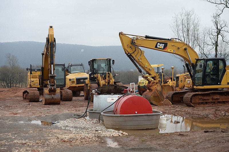 Construction machinery stands idle Thursday, March 18, 2021, at the site of Rausch-Coleman‰Ûªs incoming Prairie View subdivision in Prairie Grove. Land available to build housing is shrinking in the four major cities of Northwest Arkansas, but some smaller towns are seeing a boom in housing construction with their amount of available land. Visit nwaonline.com/210322Daily/ for today's photo gallery. 
(NWA Democrat-Gazette/Andy Shupe)