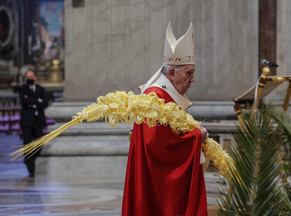 Pope Francis celebrates Palm Sunday Mass in Saint Peter's Basilica at the Vatican, Sunday, March 28, 2021. (Giuseppe Lami/Pool photo via AP)