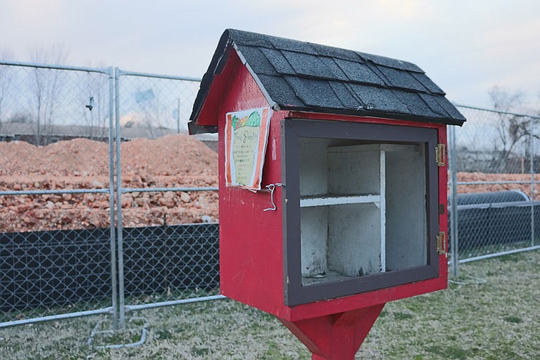 A “little free pantry” near the corner of North Avenue and the Razorback Greenway stands empty on March 4, 2021. Such pantries, which have a “take what you need, leave what you can” system, have cropped up across the U.S. in recent years. Throughout the covid-19 pandemic, some participants in the Northwest Arkansas mutual aid movement have made a routine of stocking them as they become empty, which can happen in just hours. Members of Facebook groups such as “Y’ALLIDARITY! — NWA Mutual Aid” keep each other apprised of the status of the pantries around the region and what staples are needed to replenish each.
(Courtesy Photo/Sarah E. Komar)