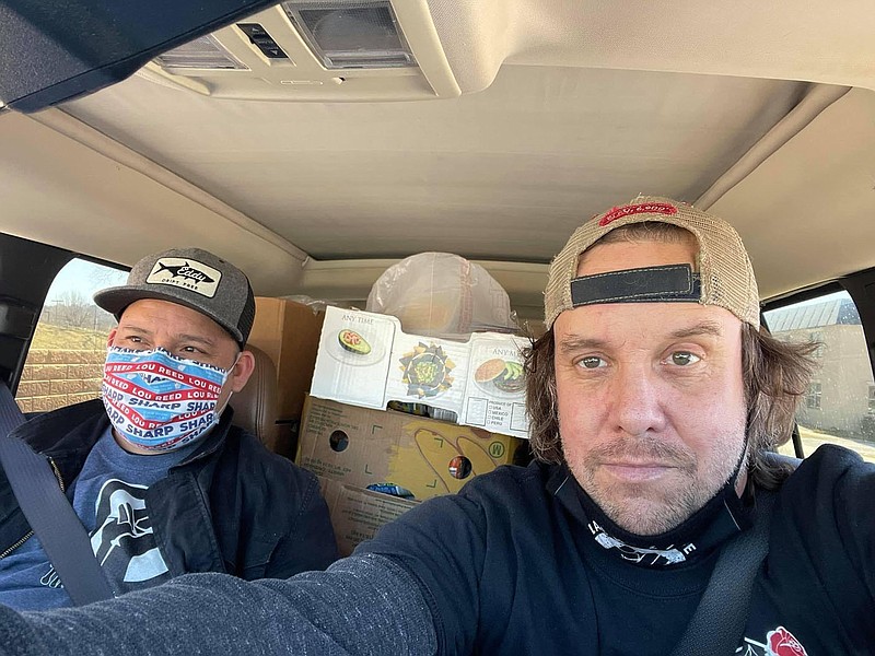 Thomas Tulensa, 36, of Springdale, and Walt Kelly, 48, of Fayetteville, make grocery deliveries to food-insecure Northwest Arkansas residents for The People’s Pantry NWA, a mutual aid food assistance organization Kelly founded and operates using community Venmo donations.

(Courtesy Photo/Walt Kelly)