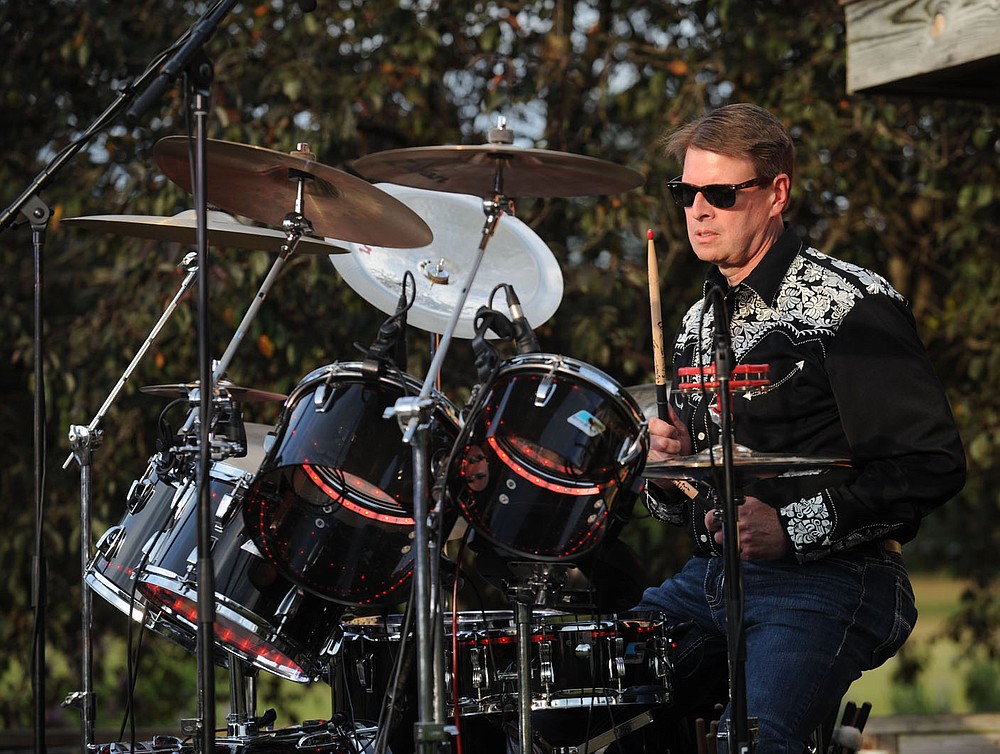 NWA Democrat-Gazette/ANDY SHUPE
Scott Varady, executive director of the Razorback Foundation, plays drums Thursday, July 25, 2019, with his band Mary-Heather Hickman and The Sinners and during the 23rd Annual Gulley Park Summer Concert Series presented by Fayetteville Parks and Recreation in Gulley Park in Fayetteville.