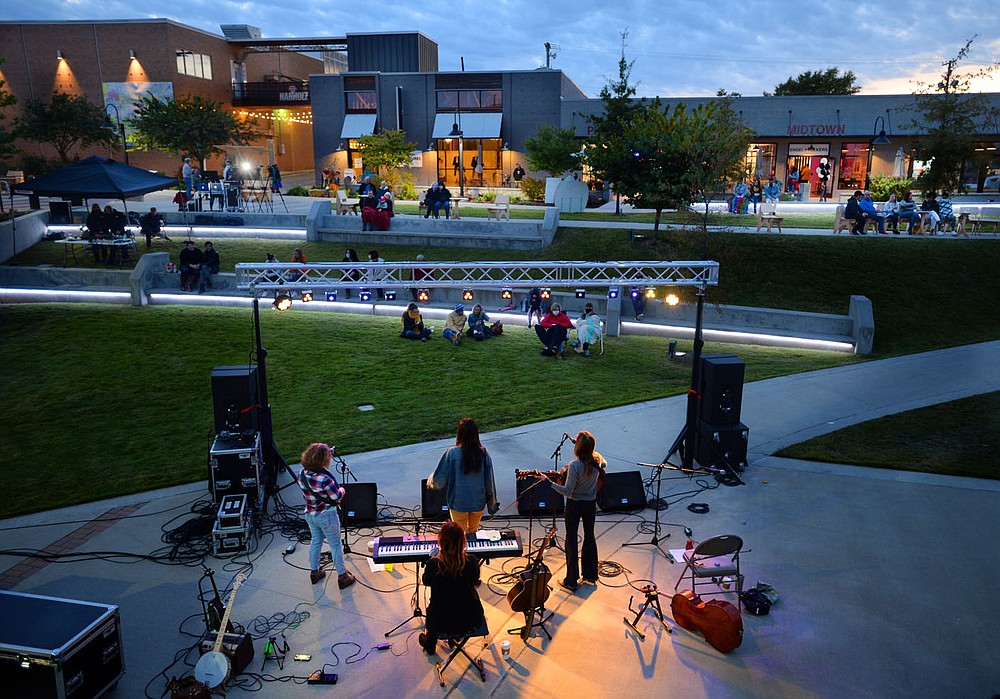 Members of the local band Dandelion Heart perform Thursday, Oct. 15, 2020, as a part of the LIVE! at Turnbow Park concert series in Walter Turnbow Park at Shiloh Square in downtown Springdale. The free concert was presented by Engel & Vˆlkers NWA, Downtown Springdale and Springdale Parks and Recreation. The next concert in the series features Pura Coco and Neako 6 p.m. Thursday with concerts planned for each of the next three Thursdays. Visit nwaonline.com/201016Daily/ for today's photo gallery.
(NWA Democrat-Gazette/Andy Shupe)
